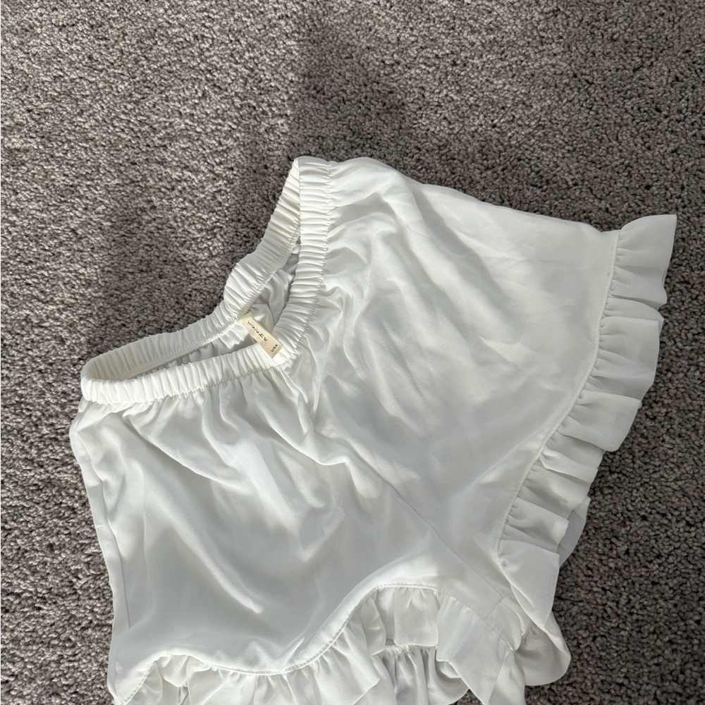 Tyche White Ruffle Hem Shorts